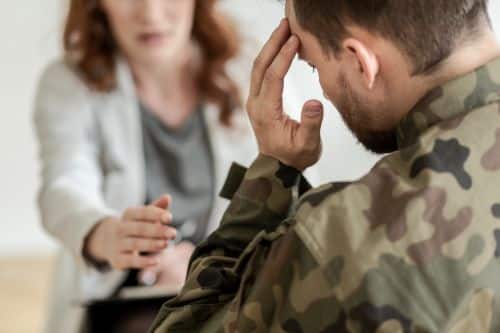 Sad soldier with divorce lawyer