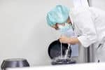 Lab tech handling oocytes and sperm for cryopreservation to be stored in liquid nitrogen.